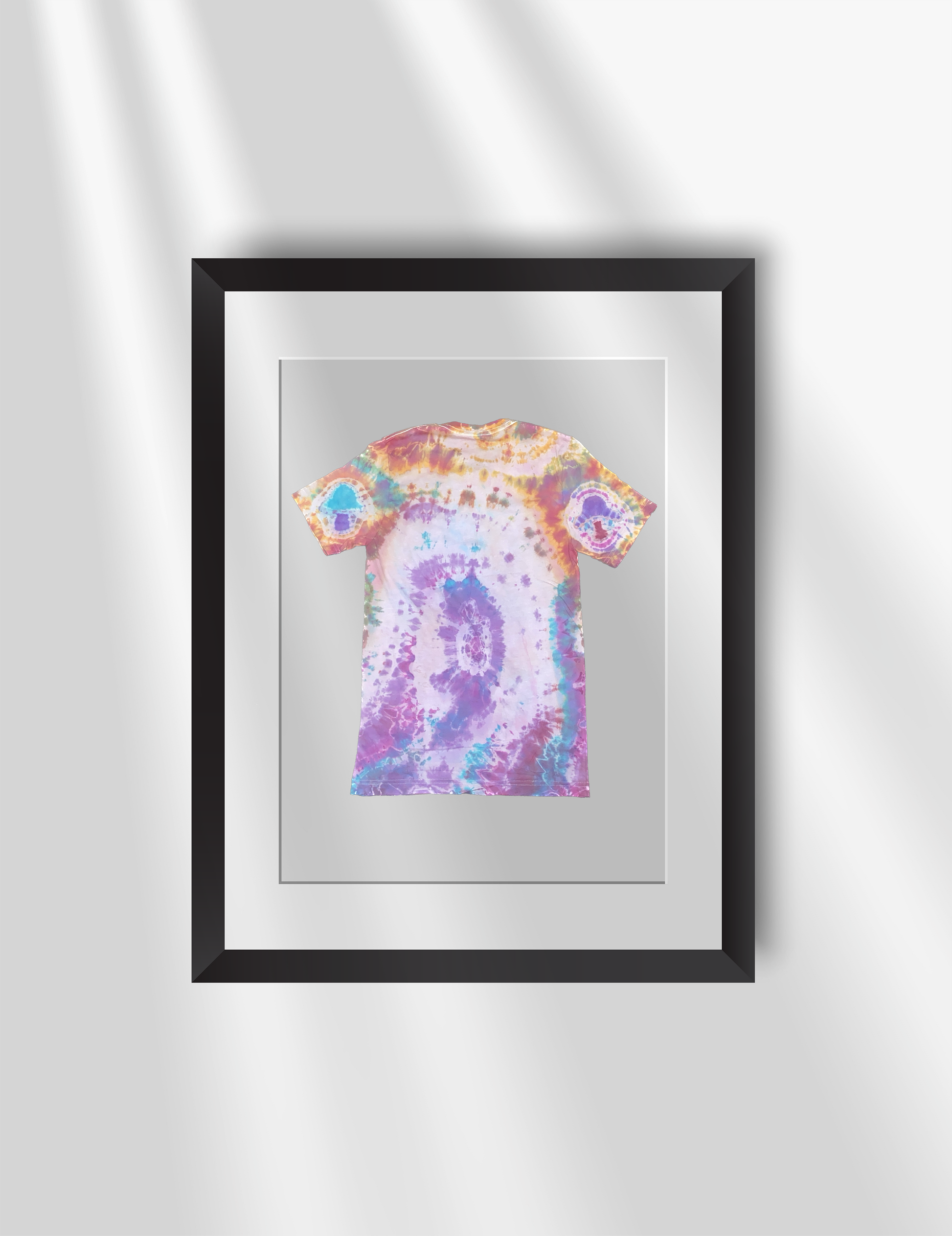 Schleepwear Tye Dye Psykhephany Tshirt Back inside a picture frame