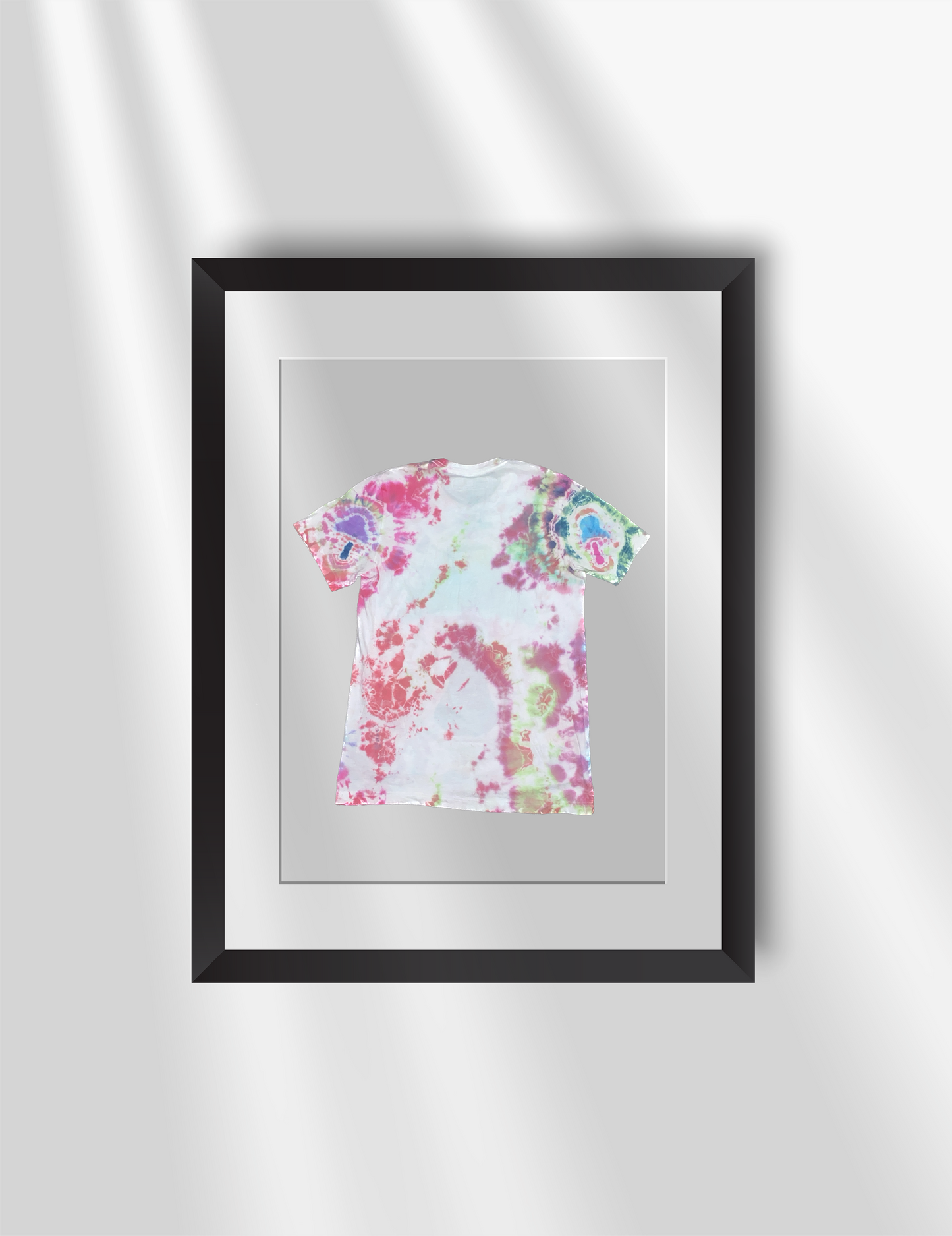 Schleepwear Tye Dye Zephyrazure Tshirt back inside a picture frame.