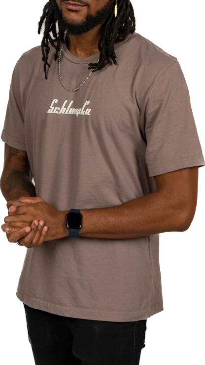 Male model wearing a Pebble Brown Minimal Schleepco Logo Tshirt